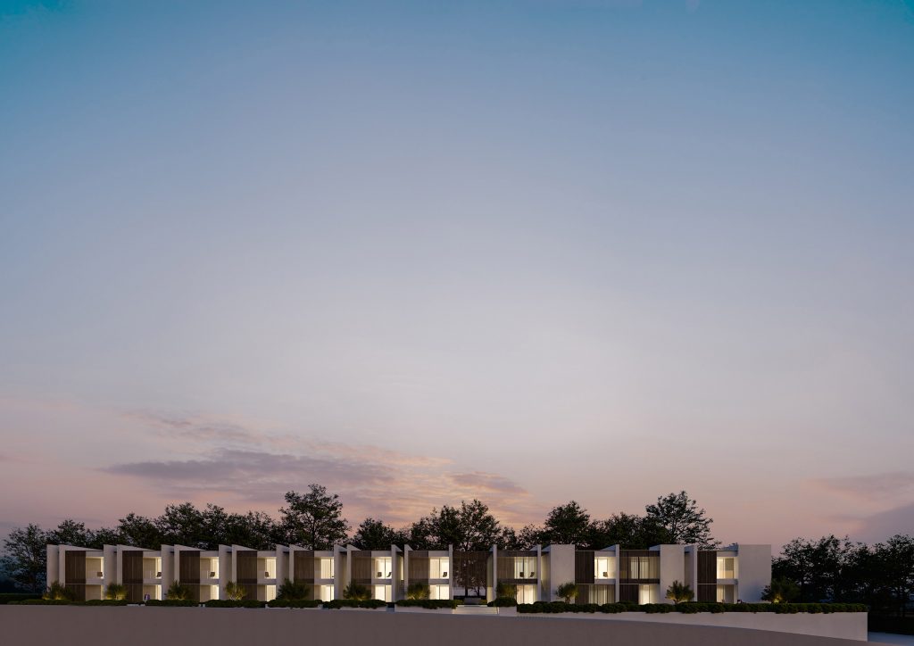 Apartments T, vista frontale serale completa dell'intervento